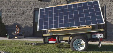 A student works on a computer connected to the free Wireless on Wheels wi-fi